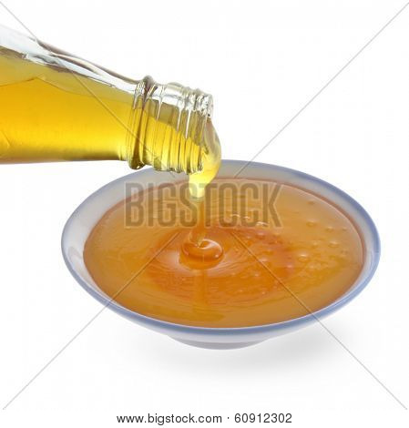Honey being poured onto a plate.