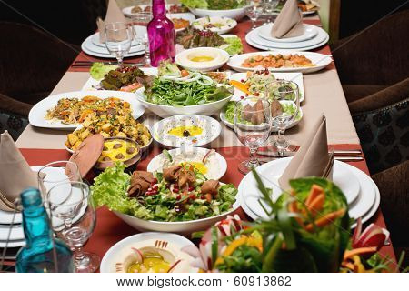 Table with various food served in a restaurant
