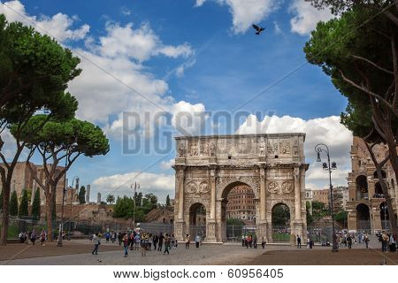ROME - OCT 17 2012: Tourists walking near Constantine's arc in Rome - triumphal arch in Rome, situated between the Colosseum and the Palatine Hill