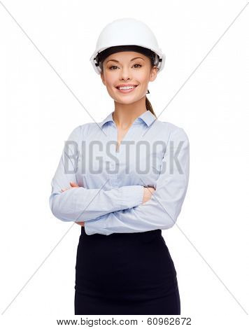 building, developing, consrtuction and architecture concept - friendly young smiling businesswoman in white helmet