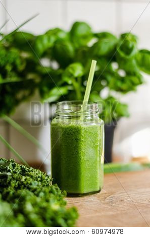 Closeup of bitter melon juice in jar on table