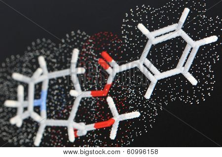close up of modeled molecule of cocaine with sticks and van der waals radii dot surface,