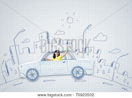 Young woman riding car made of list of paper
