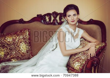 Beautiful bride with stylish make-up in white dress