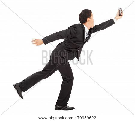 Businessman  Running Busily And Holding A Smart Phone