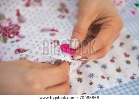 Closeup On Dressmaker Woman Sewing