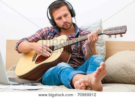 Musician Playing Acoustic Guitar