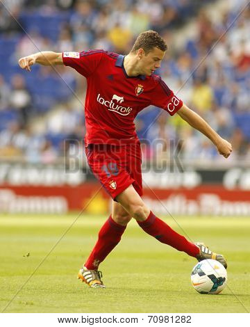 BARCELONA - MAY, 11: Oriol Riera of Osasuna in action during a Spanish league match against RCD Espanyol at the Estadi Cornella on May 11, 2014 in Barcelona, Spain