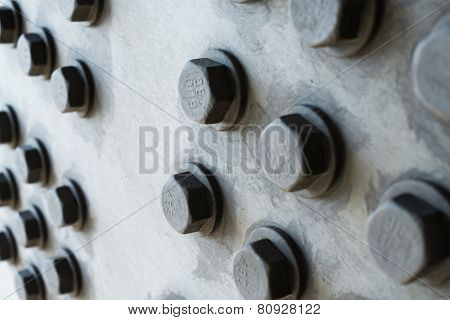 Gray Metal Surface With Hexagonal Bolt Heads
