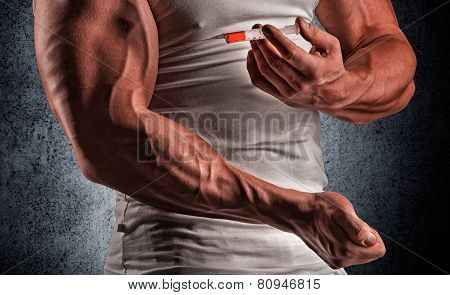 A Muscular Man With A Syringe