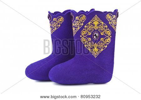 Felt boots with ornament isolated on white background