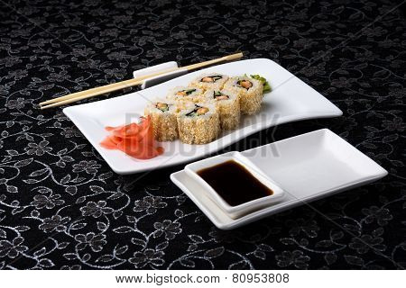 California Rolls Sushi With Pickled Ginger,vasabi And Soy Sauce In The Plate