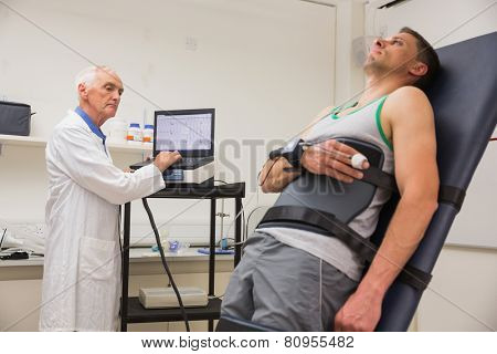 Man strapped to gurney to find out his BMR at the medical centre