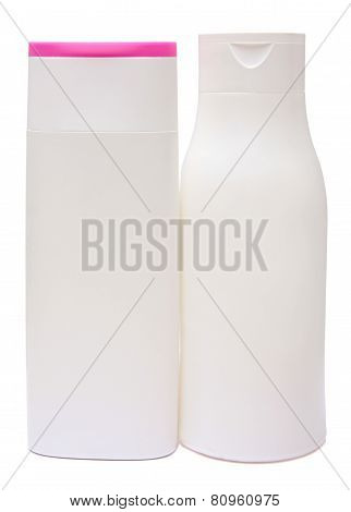 colored plastic bottles with liquid soap and shower gel.