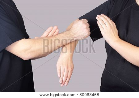 Two athletes are performing techniques Wing Chun Kung Fu