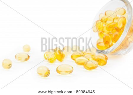 Omega 3 Fish Oil Capsules And Glass.