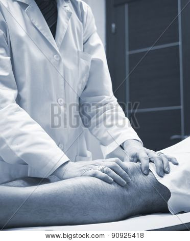 Traumatologist Orthopedic Surgeon Doctor Examining Patient
