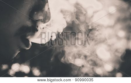soft focus ,selection focus area , blurred background ,man smoking