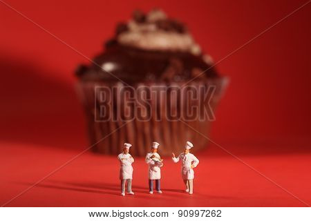 Funny Rendition of Miniature Chefs With Cupcake