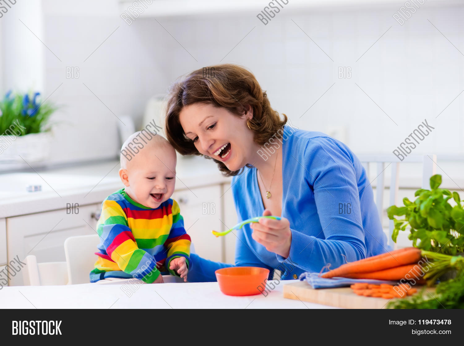 mother feeding child