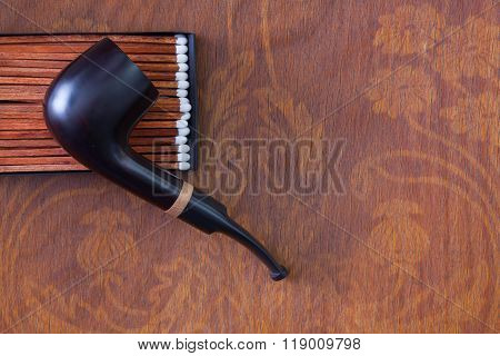 Luxury Tobacco Pipe On Wooden Desk