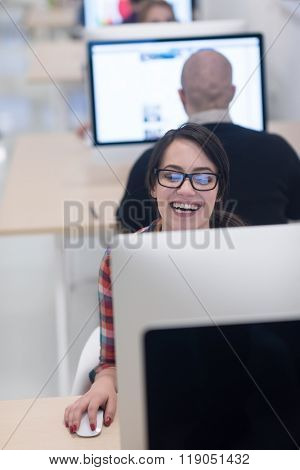 startup business, woman  working on dektop  computer at creative modern office relaxing and have fun