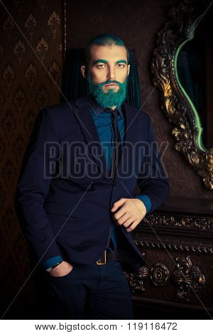 Vintage portrait of a handsome man with blue beard. 
