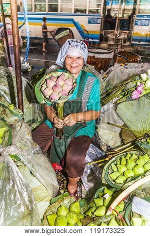 Unidentified Woman Sells Flowers On The Street