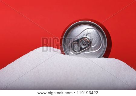 Cola Refreshing Drink Can Sitting In Pure White Sugar Mountain