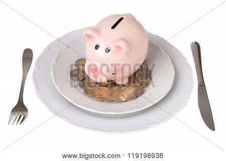 Piggy Bank With Coins On A Plate