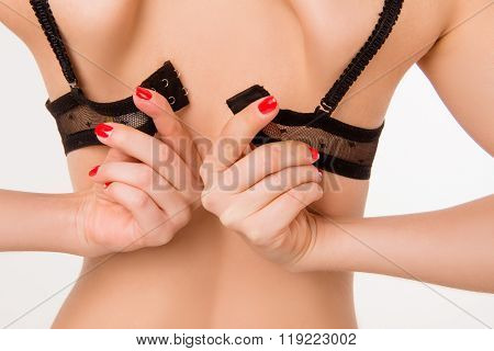Closeup Photo Of Sexy Girl With Red Nails Fasten Her  Black Bra
