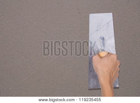 Hand Of Worker Use Trowel Plastering Concrete At Wall