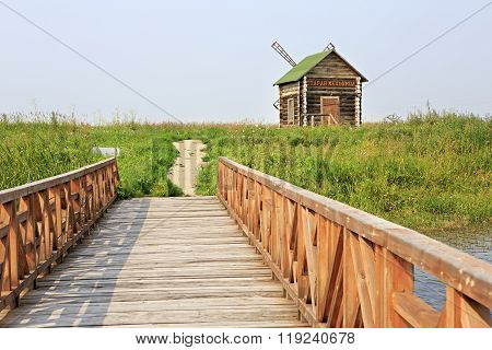 Bridge of love and an old mill. Tourist Complex Siberian Podvorye.