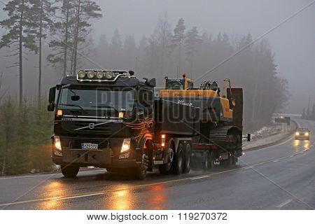 Volvo FM Semi Hauls Crawler Excavator In Fog