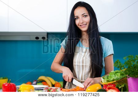 Woman cooking in the kitchen healthy food