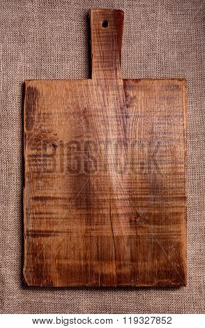 Cutting Board On Dark Fabric Background