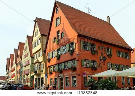 DINKELSBUHL GERMANY - AUGUST 10 2015: Wine market street with its magnificent gabled buildings. Dinkelsbuhl is old Franconian town one of the best-preserved medieval urban complexes in Germany.