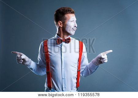 Two Funny Mimes Isolated On Gray Background