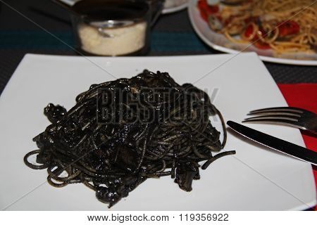 Italian Pasta Al Nero With Seafood And Tomatoes. Venice, Italy