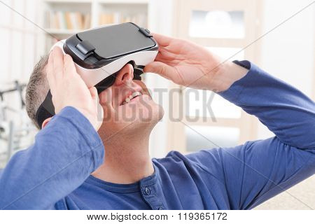 Man using virtual reality headset at home