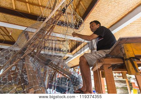 BALI, INDONESIA - FEB 24, 2016: Unidentified local people during built Ogoh-ogoh are statues for the Ngrupuk parade, which takes place on the eve of Nyepi day. Nyepi is a public holiday in Indonesia.