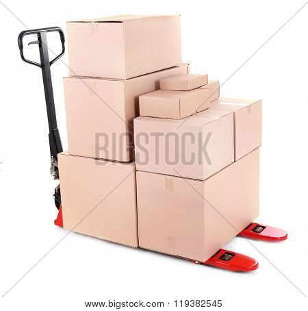 Fork pallet truck with stack of cardboard boxes isolated on white