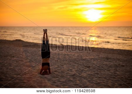 Beach yoga session by polish sea