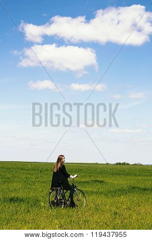 Happy Young Woman With A Vintage Bicycle On A Green Meadow. Youn