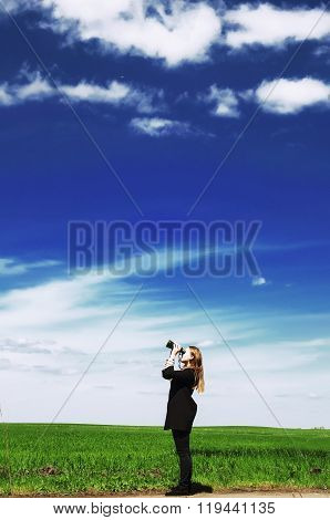 Happy Young Woman With A Vintage Bicycle On A Green Meadow. Youn
