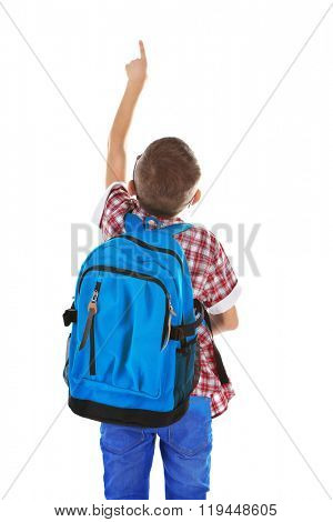 Little boy with glasses and back pack pointing finger upwards, isolated on white