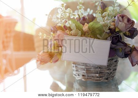 White Paper Blank On Flowers Vase Decorated In Living Room