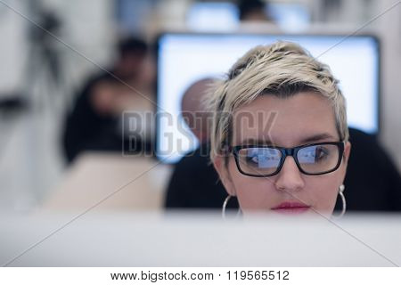 startup business, woman  working on dektop  computer at creative modern office relaxing and have fun