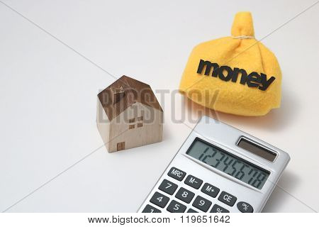 House, money, and calculator
