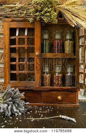 Vintage Wooden Spice Rack Or Storage Cabinet And Six Glass Bottles